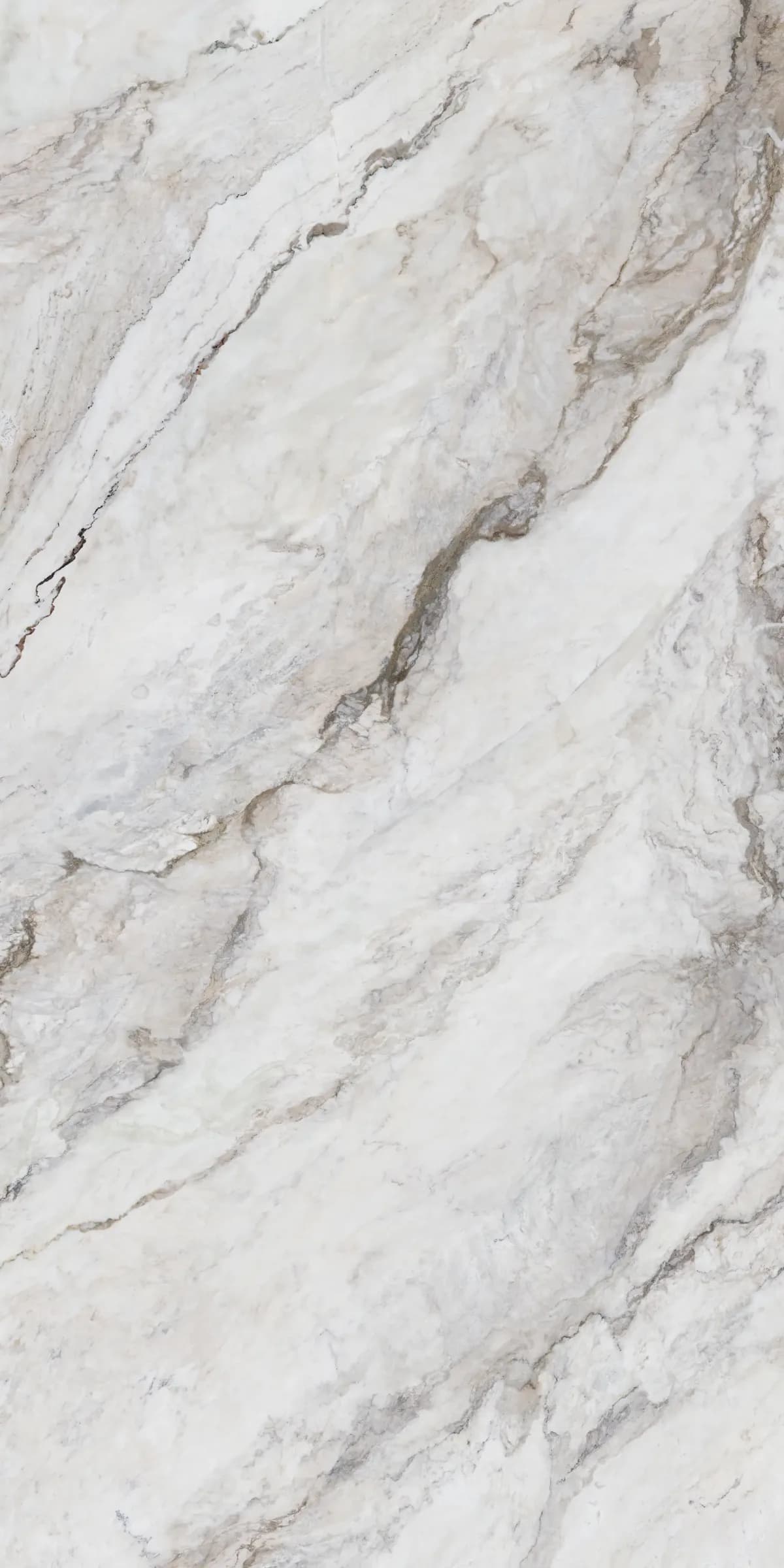 Anatolia porcelain slab in a natural matte finish, a soft white and taupe quartzite surface with gentle diagonal movement