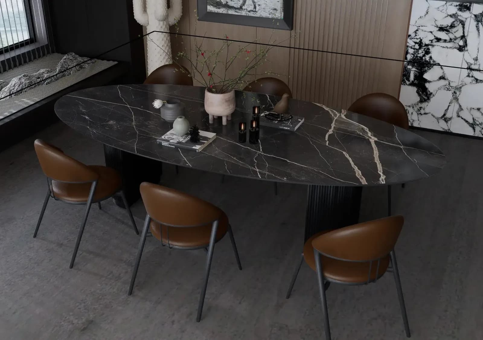 Oval Calacatta Black porcelain dining table with white and bronze veining on fluted twin pedestals, set with tan leather chairs in a dark interior